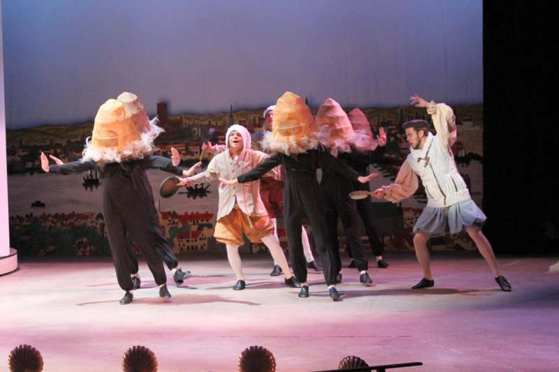 a group of people wearing clothing on a stage