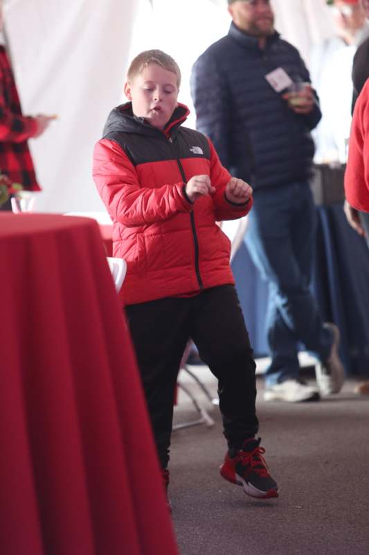 a boy in a red coat