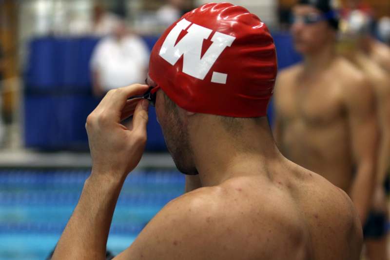 a man wearing a swimming cap