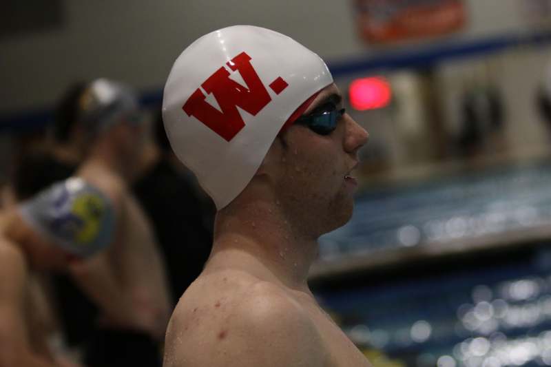 a man wearing a swimming cap
