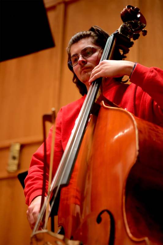 a person playing a cello