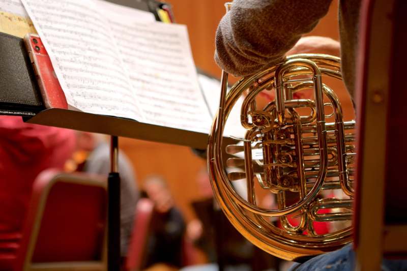 a person playing a french horn