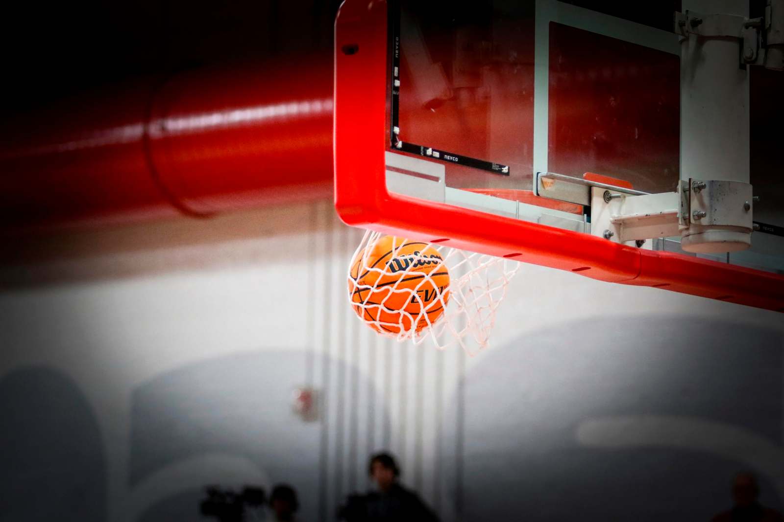 a basketball going through a net