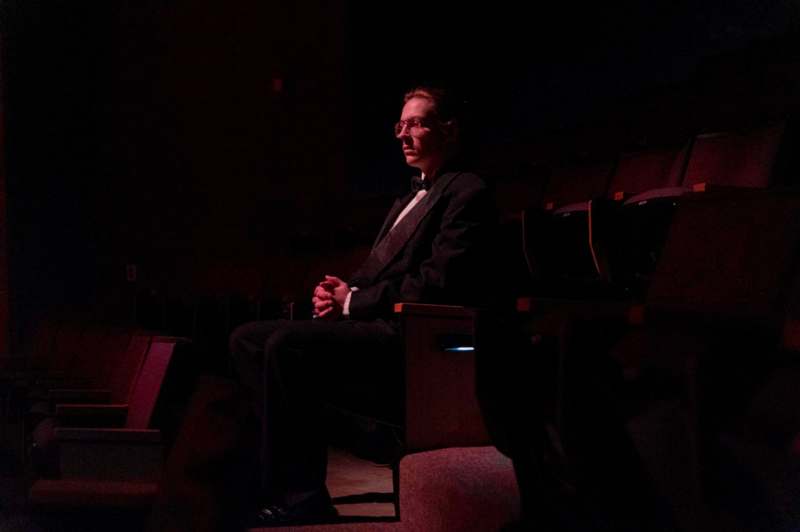 a man sitting in a theater