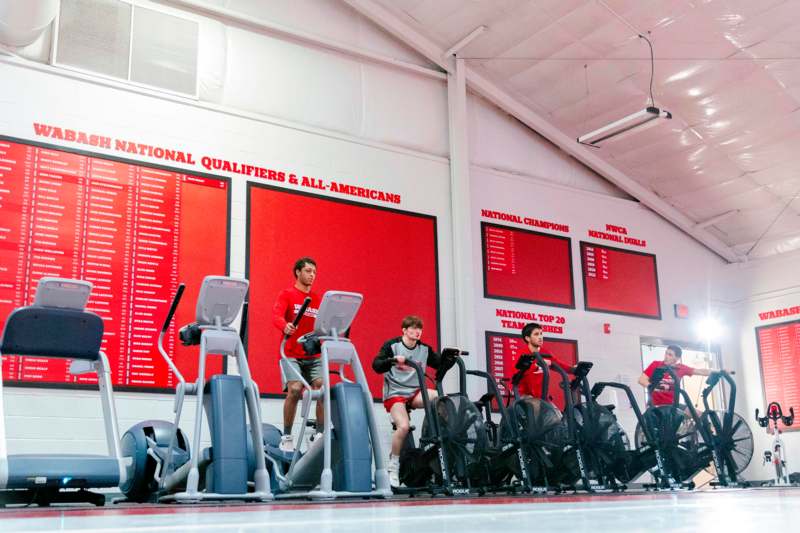 a group of people on exercise bikes in a gym