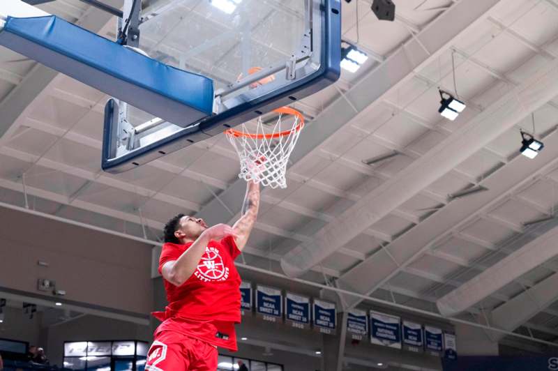 a man dunking a basketball