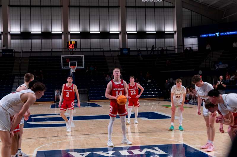 a group of people on a basketball court