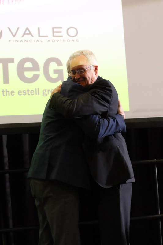 two men hugging each other