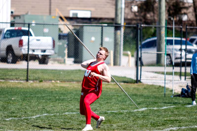 a man holding a javelin