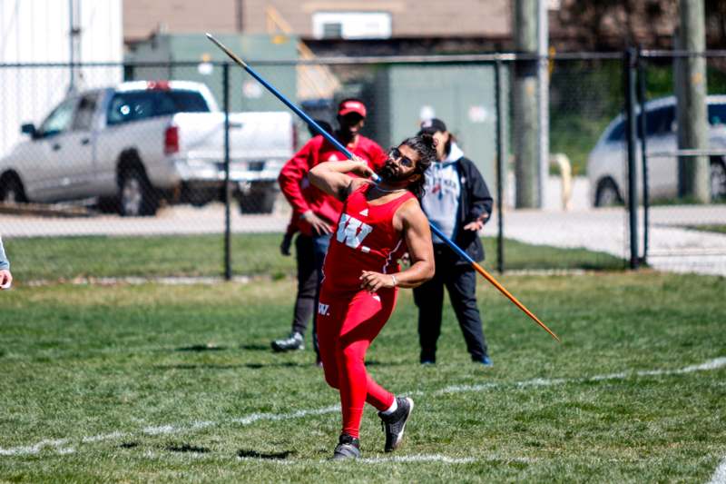 a man holding a javelin