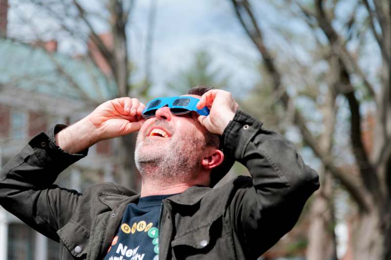 a man wearing blue sunglasses