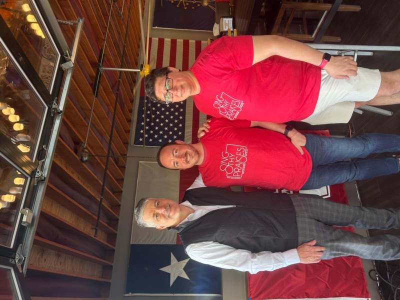 a group of men posing for a picture