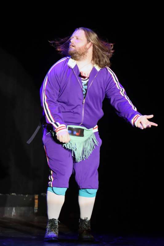a man in a purple outfit