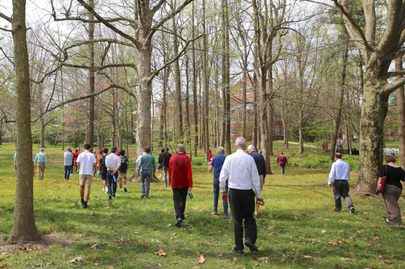 a group of people walking in a park