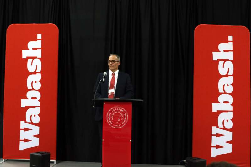 a man standing at a podium
