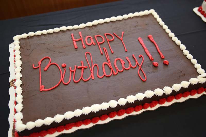 a birthday cake with red frosting