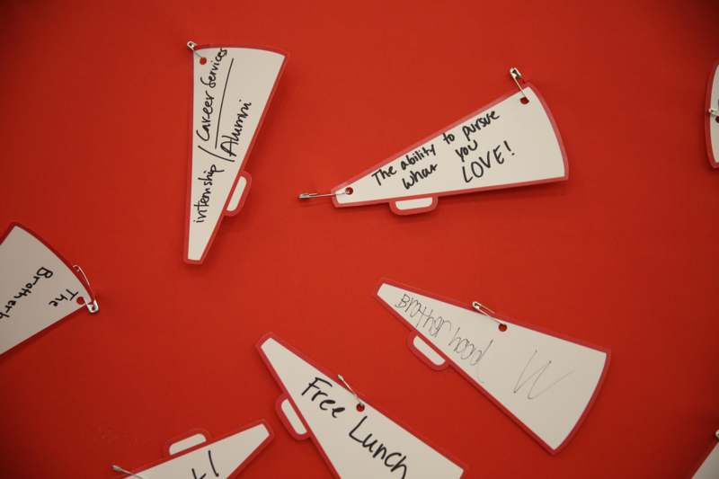a group of paper tags with writing on them