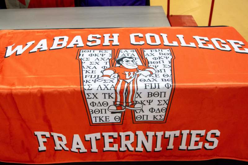 an orange table cloth with white text and a cartoon character on it