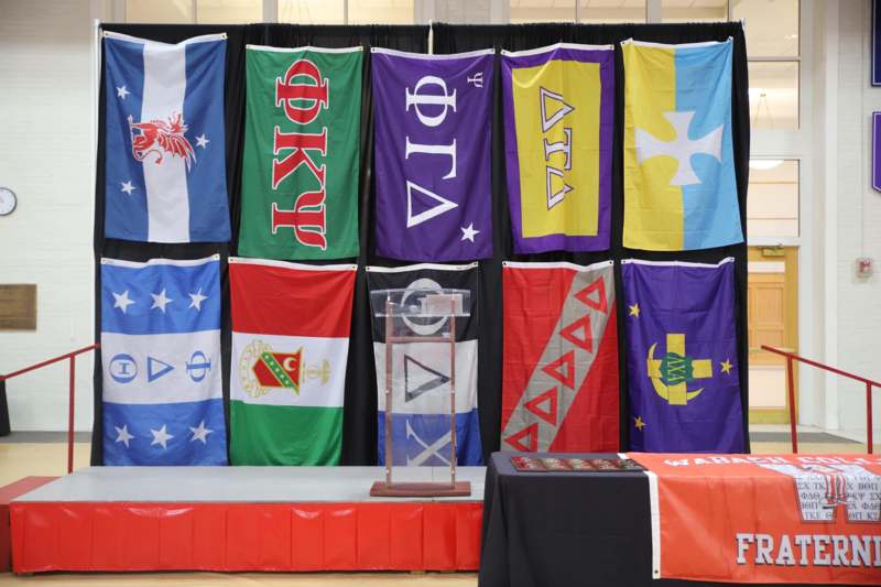a group of flags on a stage