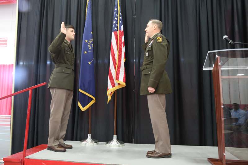 a man saluting another man in uniform