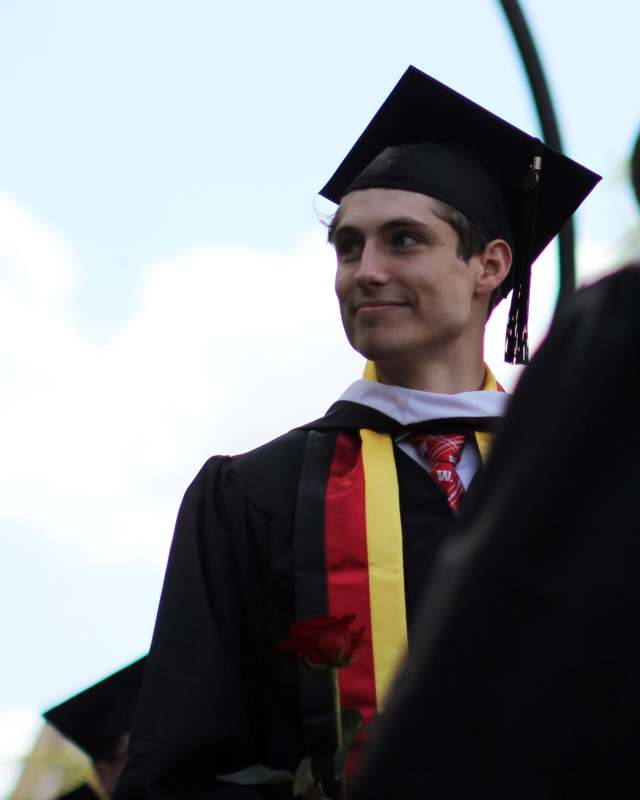 a man in a graduation gown