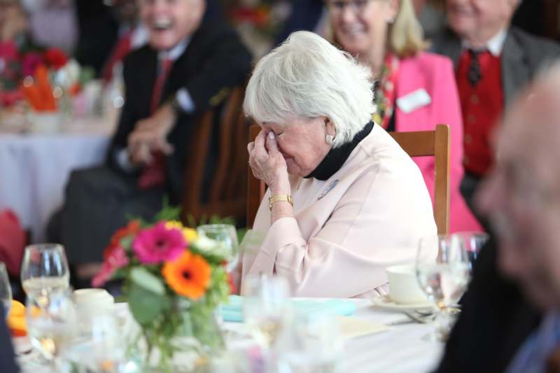 a woman crying at a table