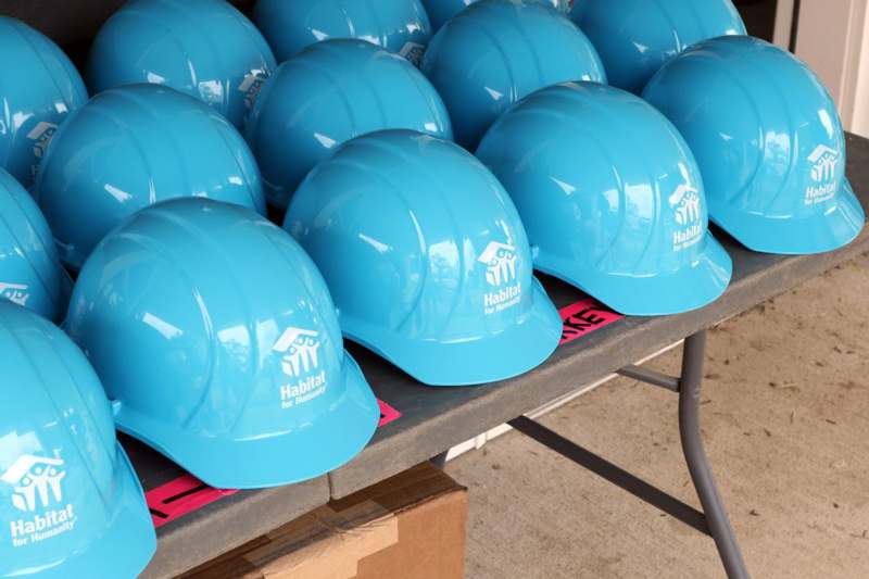 a group of blue hard hats on a table