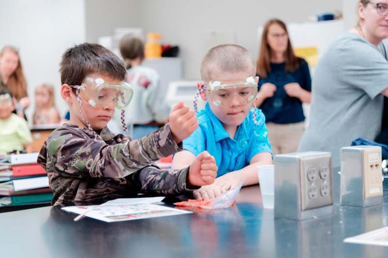 a group of kids wearing safety goggles