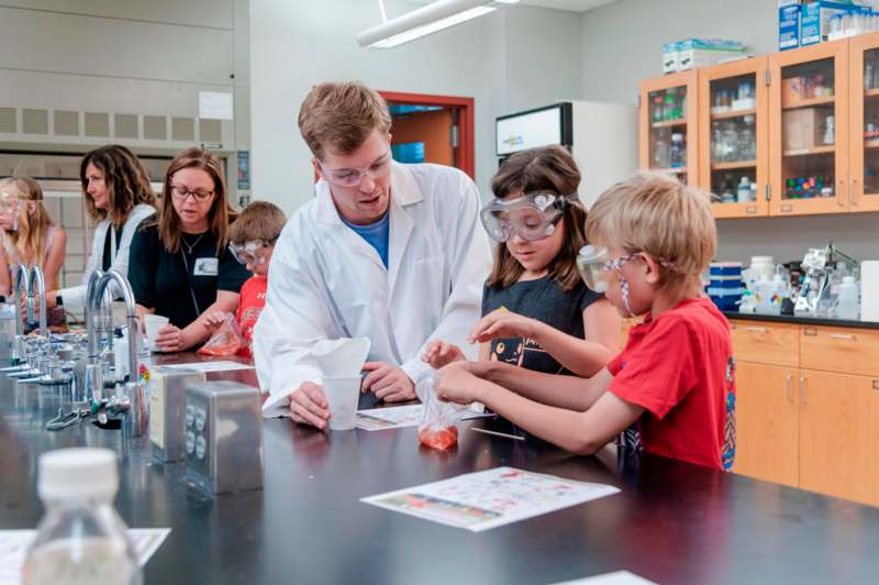 a group of kids in a lab