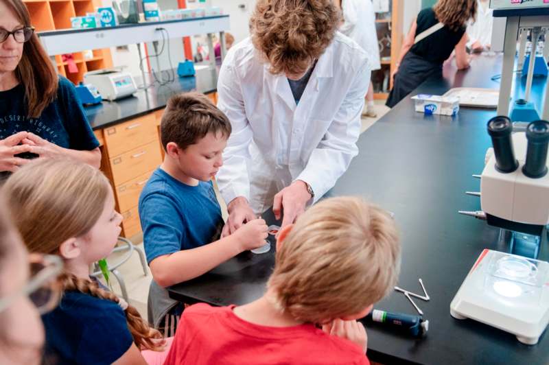 a group of kids in a lab