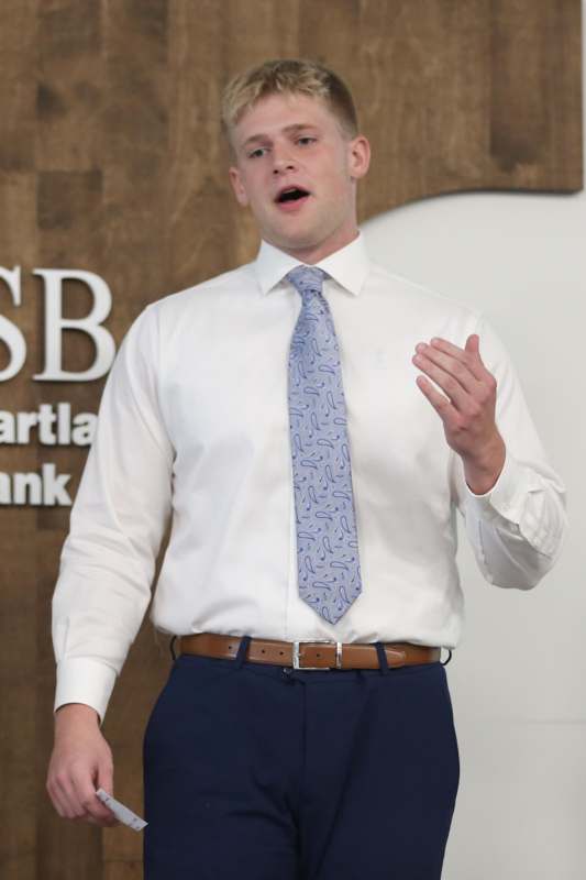 a man in a white shirt and blue tie