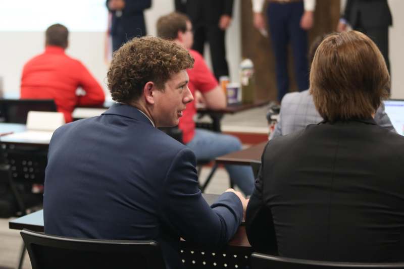 a group of people sitting at a table