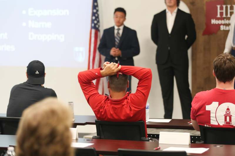 a group of people in a meeting