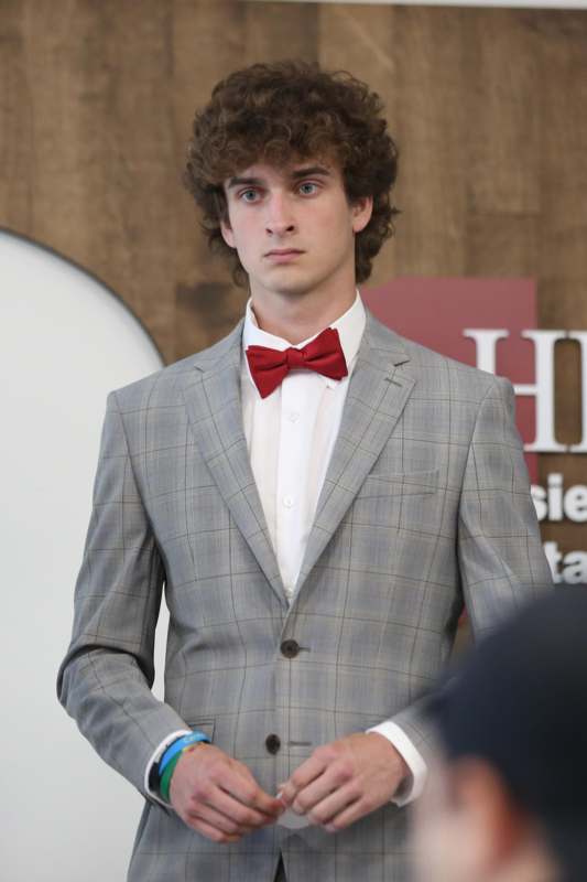 a man in a suit and bow tie