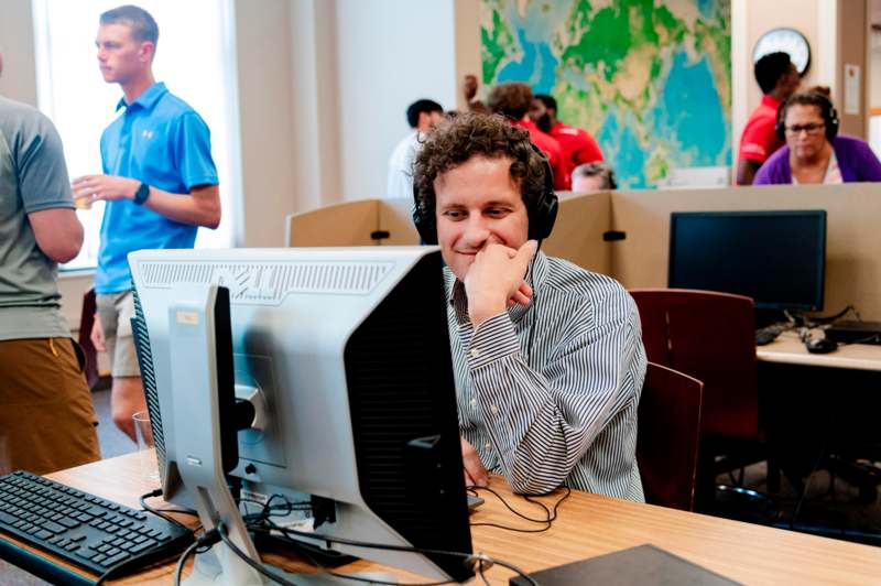 a man sitting at a computer