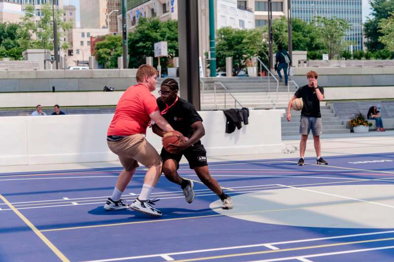 a group of men playing basketball