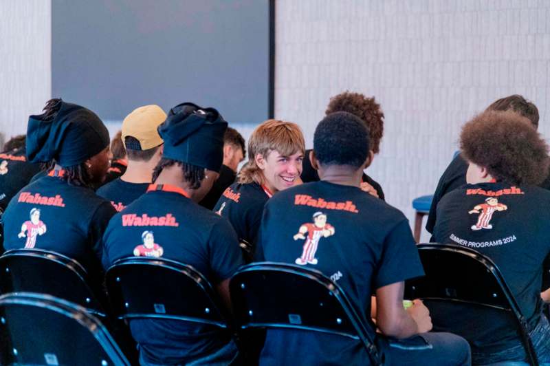 a group of people sitting in chairs