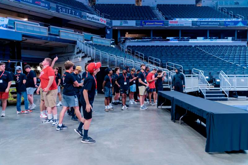 a group of people standing in a row