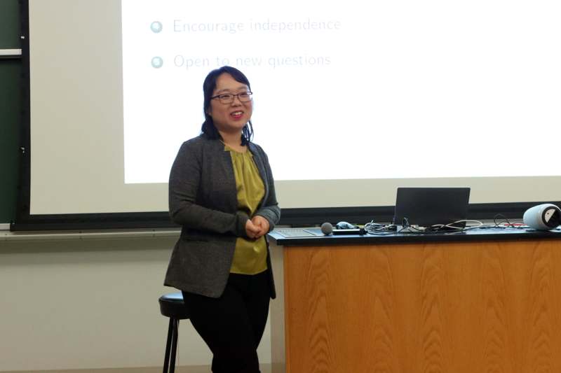 a woman standing in front of a podium