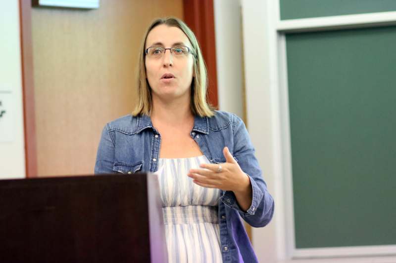 a woman standing at a podium