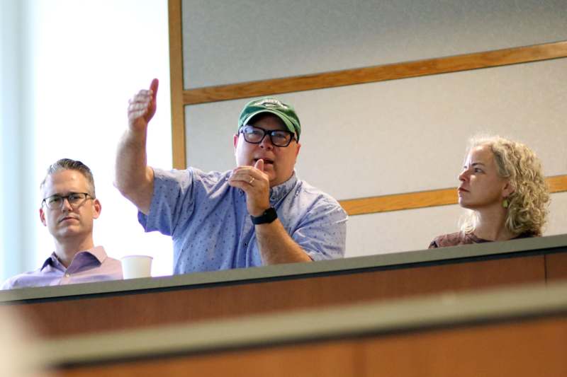 a group of people sitting at a desk