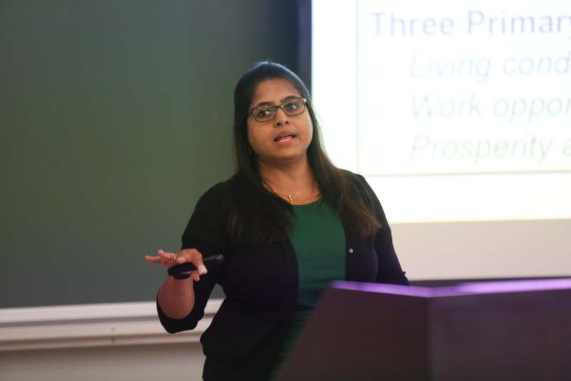 a woman standing in front of a podium