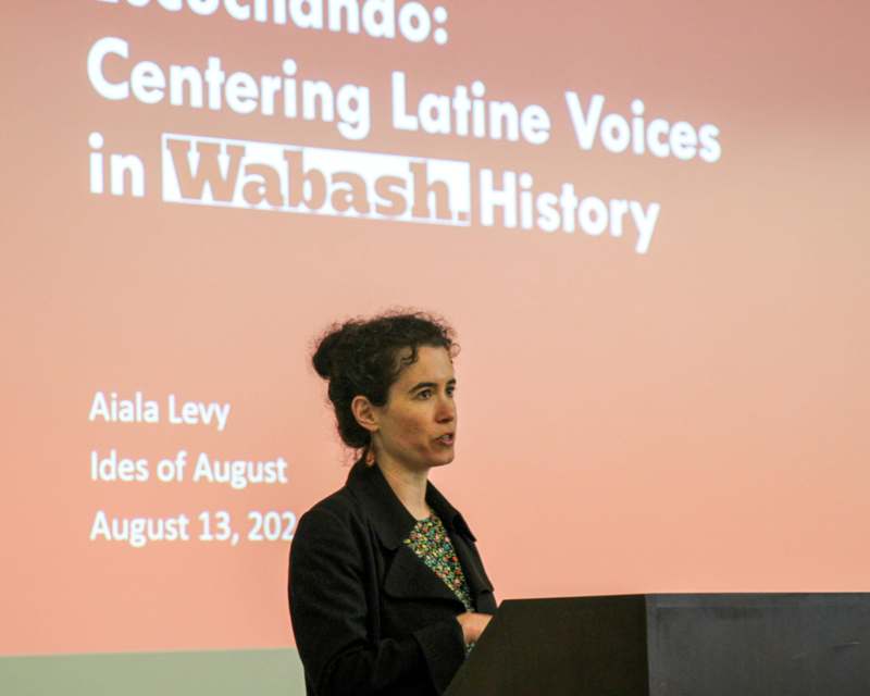 a woman standing at a podium