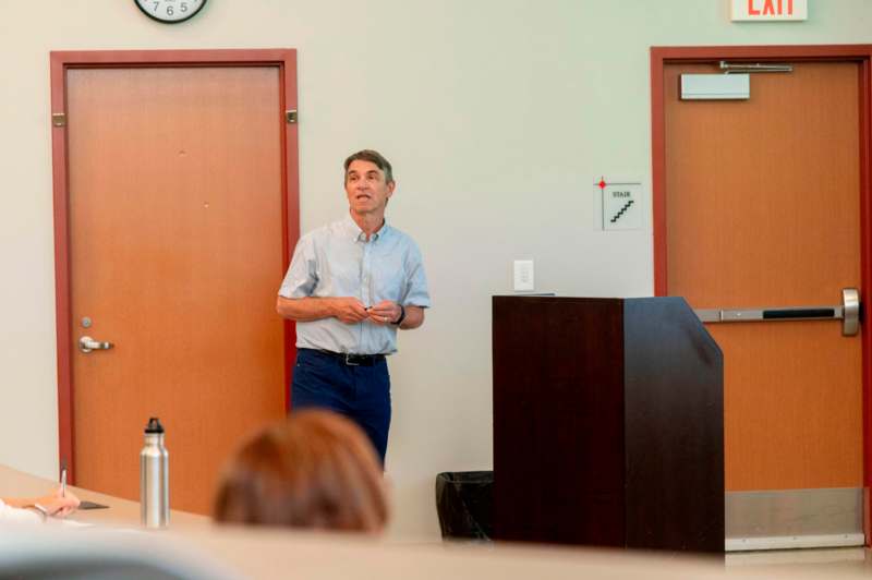 a man standing in front of a podium