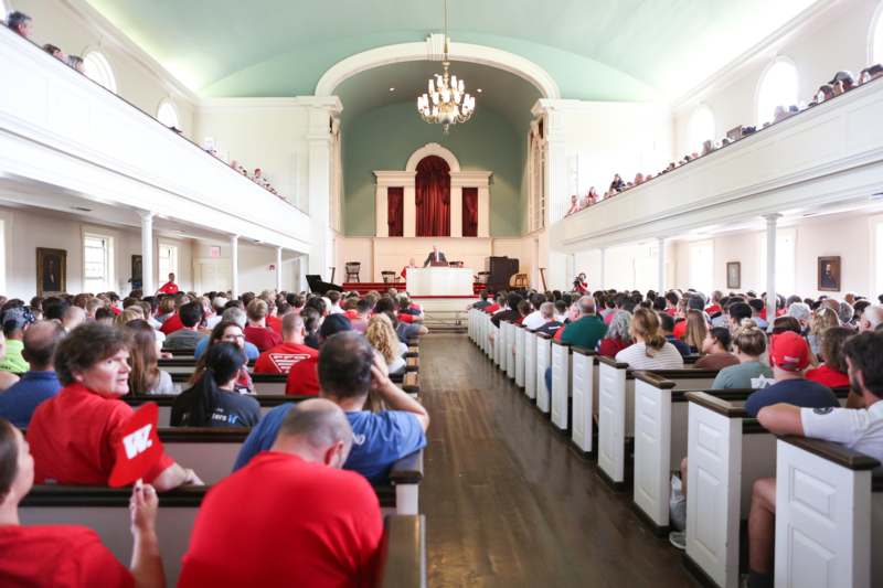 a group of people sitting in a church