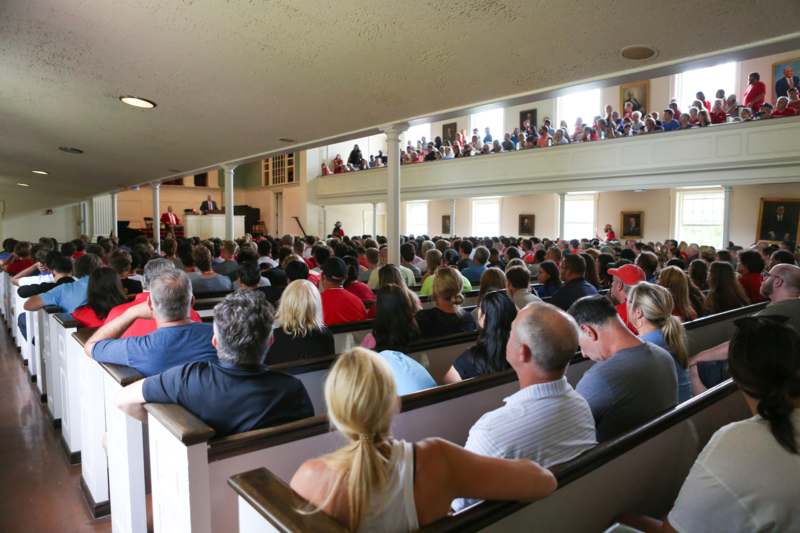 a group of people sitting in a room