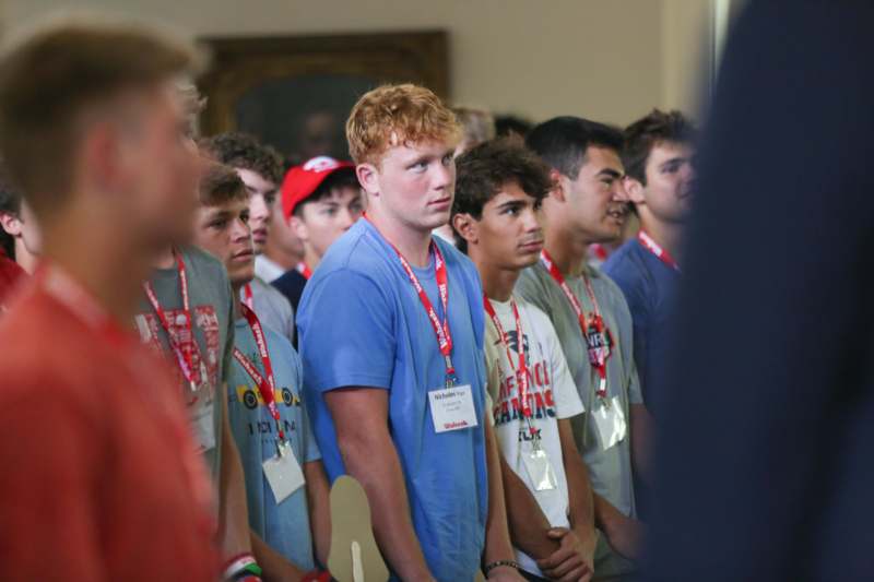 a group of people standing in a line