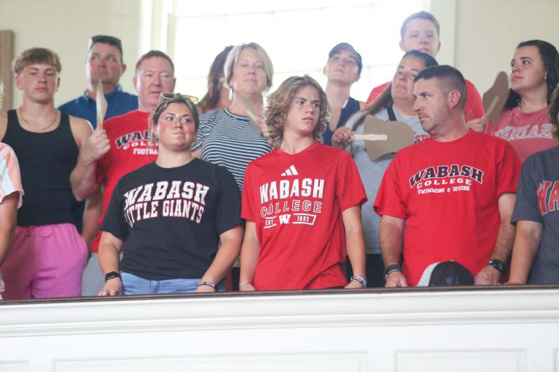 a group of people standing in a room