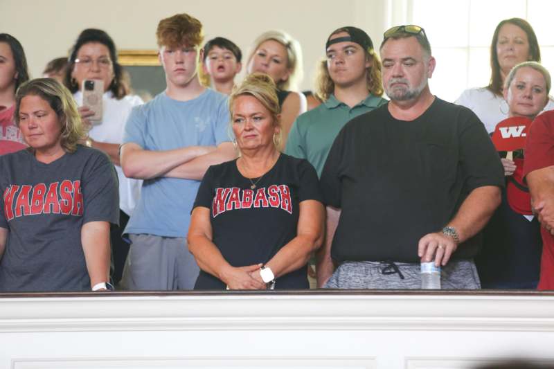 a group of people standing in a room