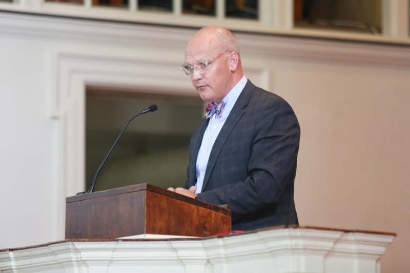 a man standing at a podium